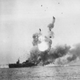 The escort carrier USS St. Lo (CVE-63) explodes following a kamikaze attack during the Battle of Leyte Gulf (US Navy)
